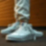 Vans white high-top sneakers paired with athletic wear